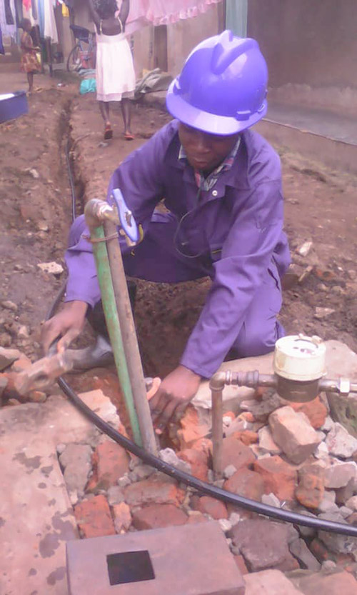 Waako Ronald during practical work of plumbing in Jinja